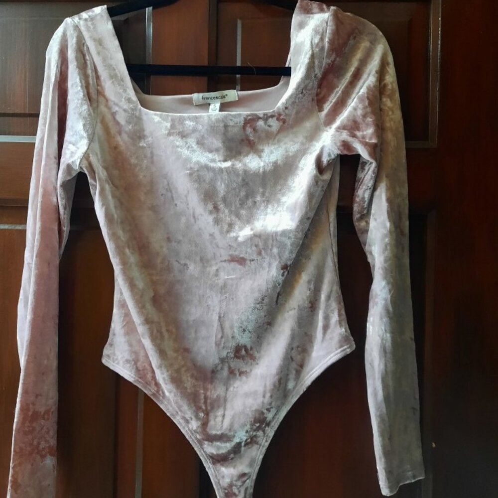 Francesca's small light pink bodysuit